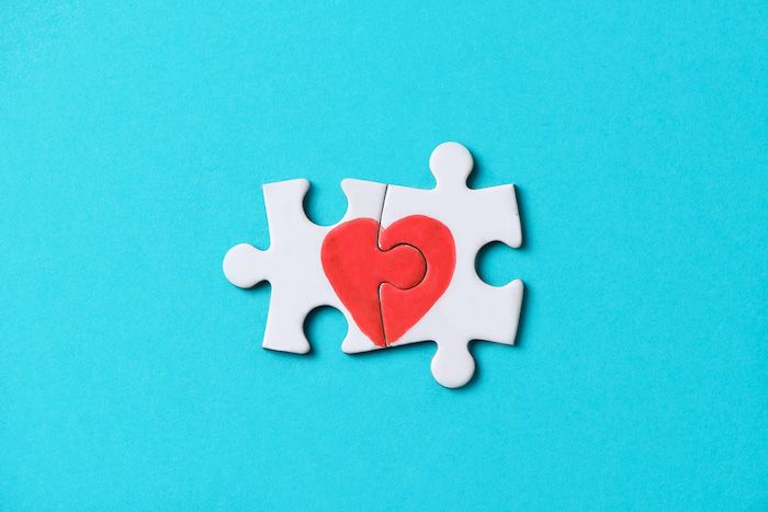 Pieces Of A Puzzle Forming A Heart